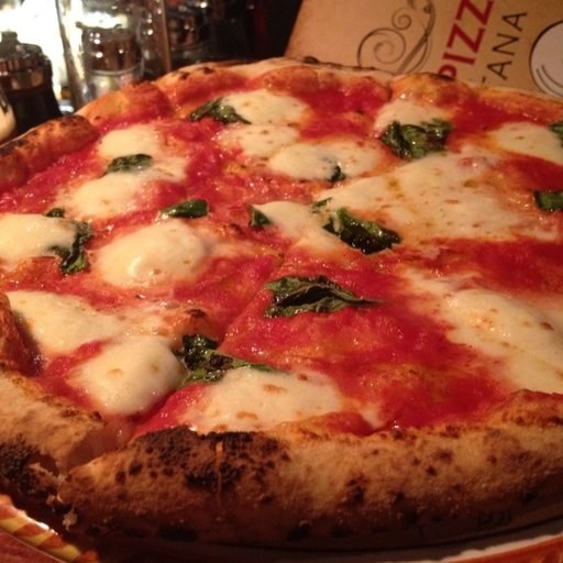 A pizza on a wooden board: one training image for the pizza class.