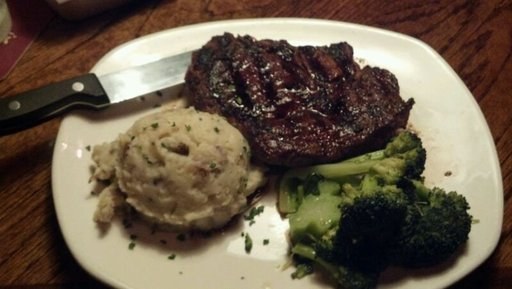 A steak with potato and broccoli on a plate: one training image for the steak class.